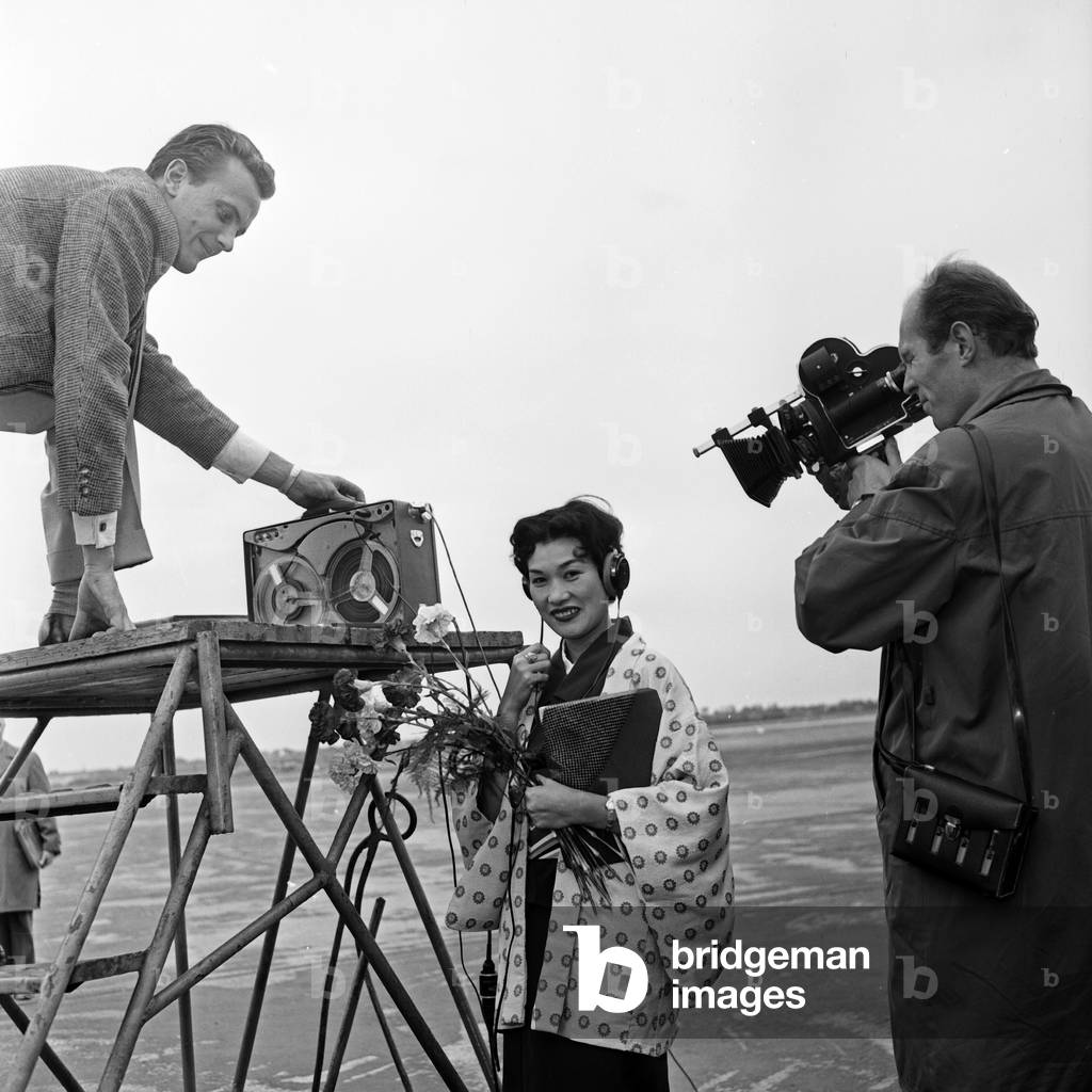 Female Japanese singer Butterfly arrives at Hamburg airport, Germany 1950s