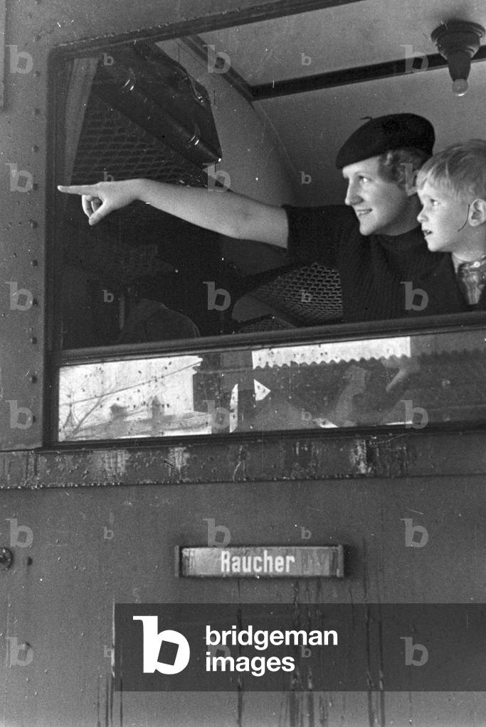 Rail traffic in a snowy winter landscape, Germany 1930s (b/w photo)