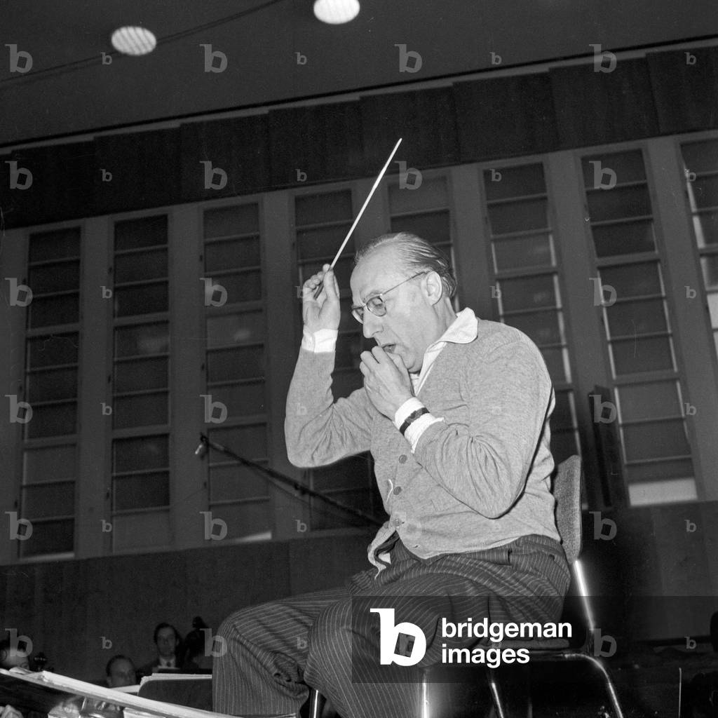 A conductor of a choir performing at Studio 10 of German TV and radio station NDR at Hamburg, Germany 1950s