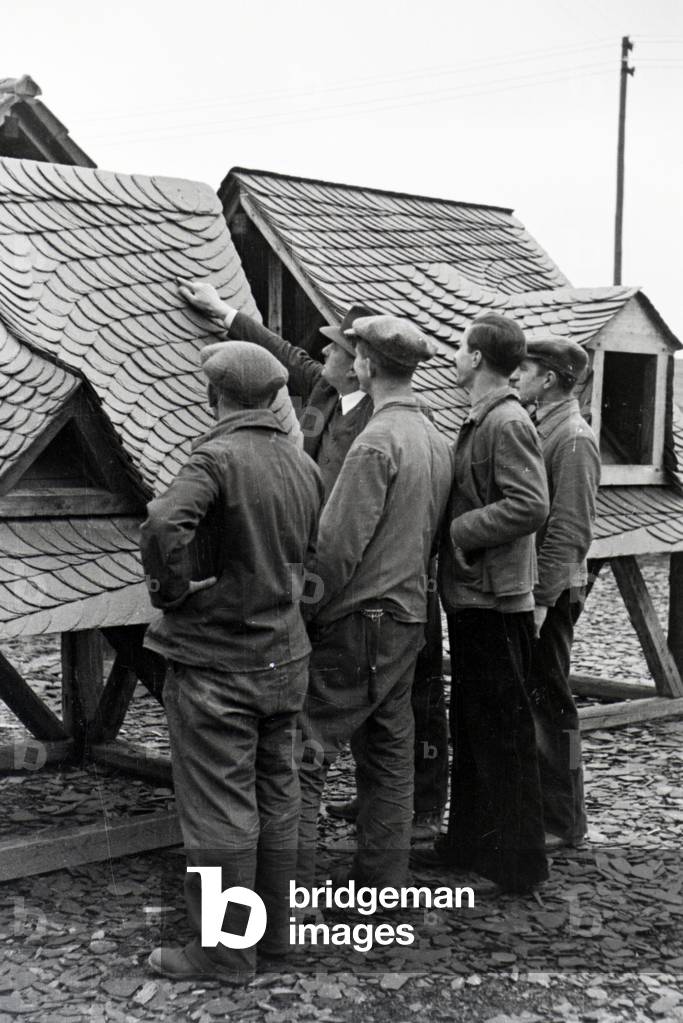 Trainees of a roofer school at a tutorial, Germany 1937 (b/w photo)