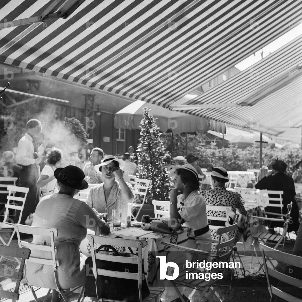 People at a cafe in Stuttgart, Germany 1930s (b/w photo)