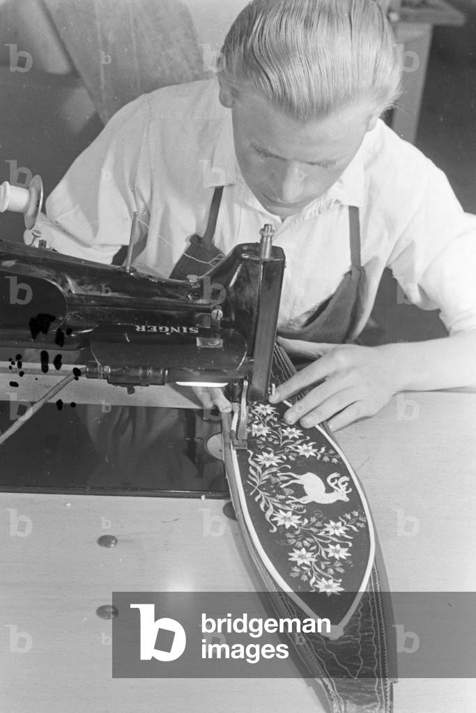 A tailor from Bad Tölz making Lederhosen, Germany 1930s (b/w photo)