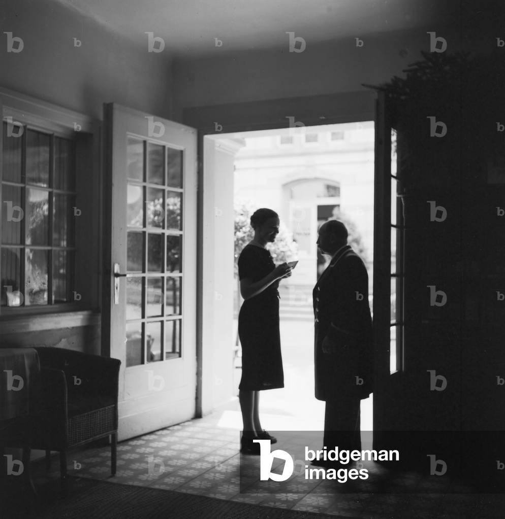 German actress Evelyn von Schoenfeld at the spa resort Villa Sommerberg at Bad Rippoldsau Schwapbach in the Black Forest region, Germany 1930s (b/w photo)