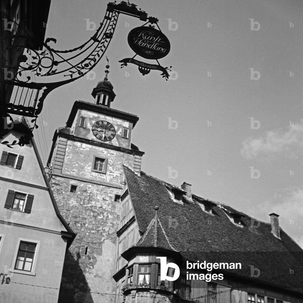 White tower with Geissendorf's art shop in front of at Rothenburg ob der Tauber, German 1930s (b/w photo)