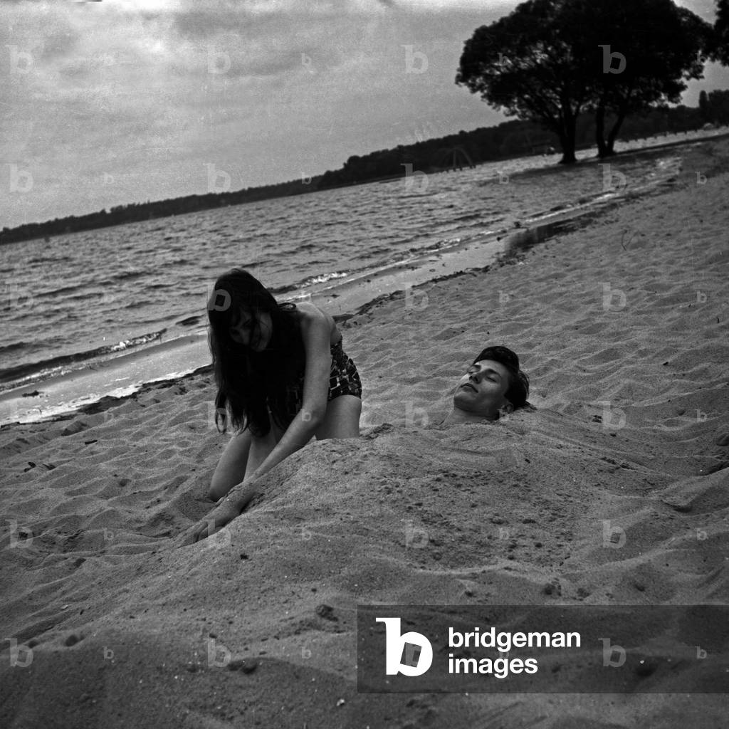 Siblings Maria and Franco Duval on the beach at the shore of a lake at Berlin, Germany 1950s