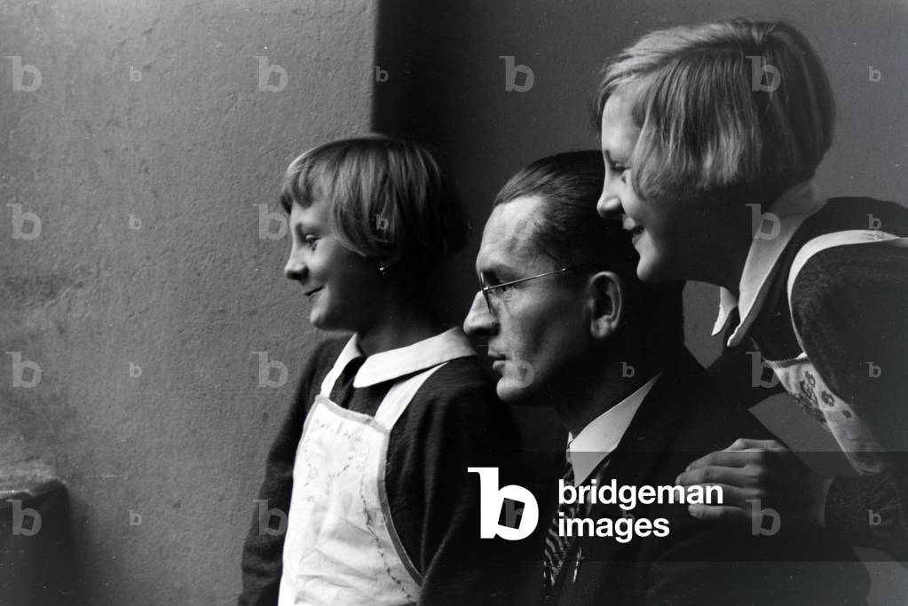 Two of the quadruplets of Brücken with their father, Germany 1930s (b/w photo)