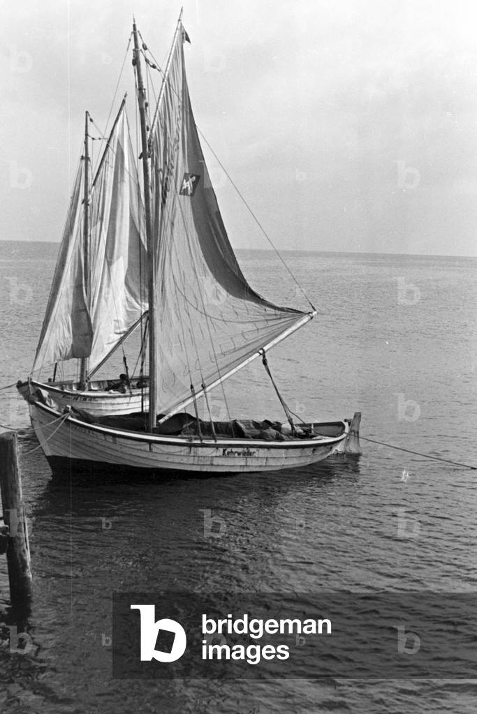 Two sailing boats at the coast of the Baltic Sea, Germany 1930s (b/w photo)
