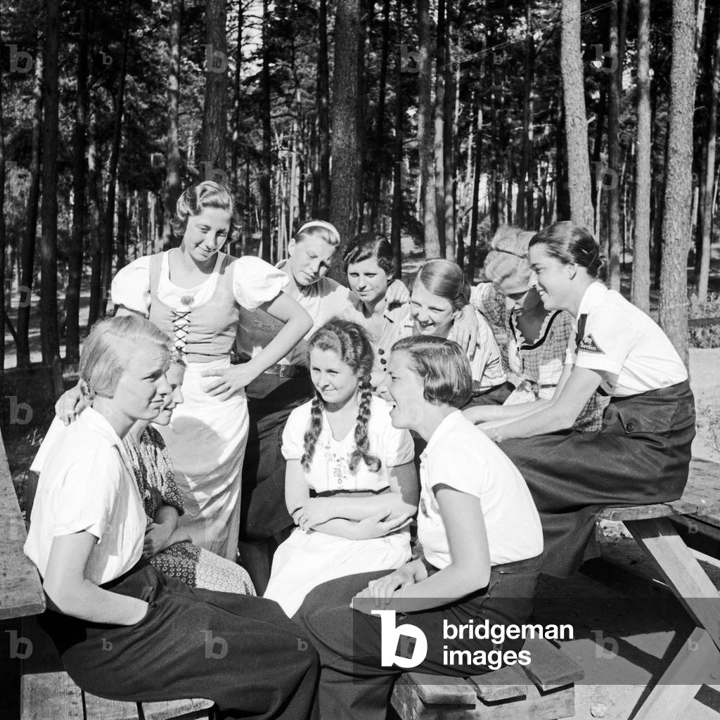 A group of BDM girls sitting in the sun at leisure camp of Deutsche Arbeitsfront at Altenhof, Brandenburg, 1930s (b/w photo)