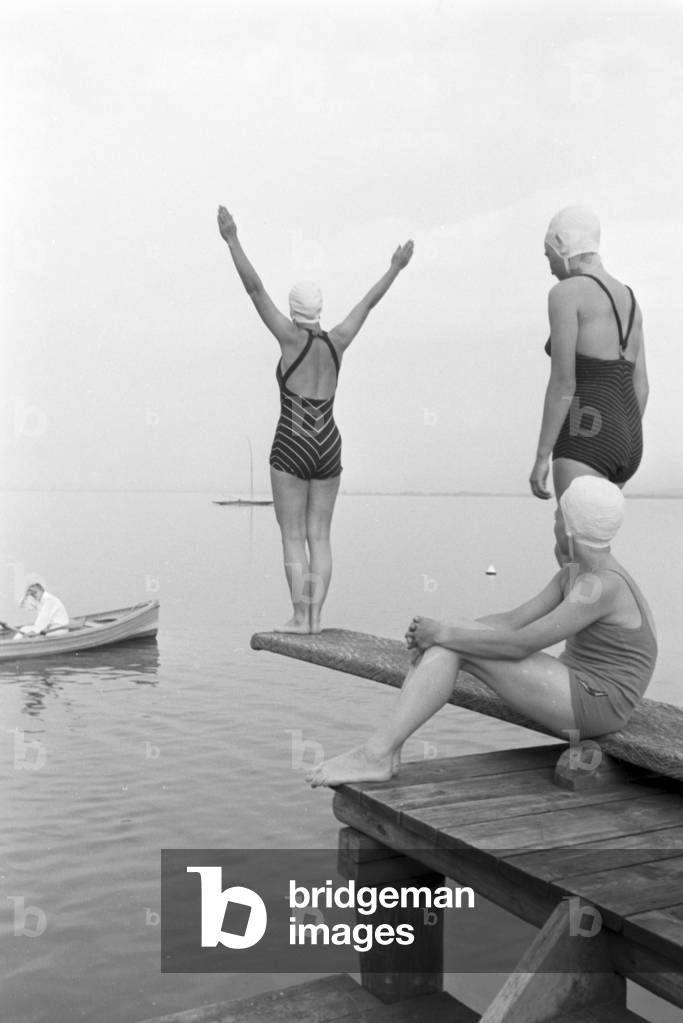 Swimming during the sailing lessons on the Chiemsee, Germany 1930s (b/w photo)