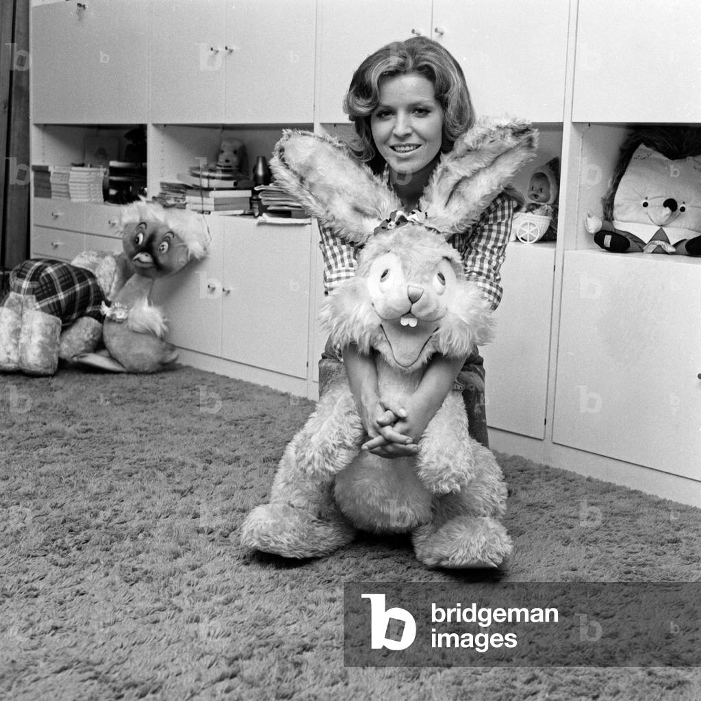 German schlager singer Manuela with a rabbit from her plush toy collection, Berlin 1972