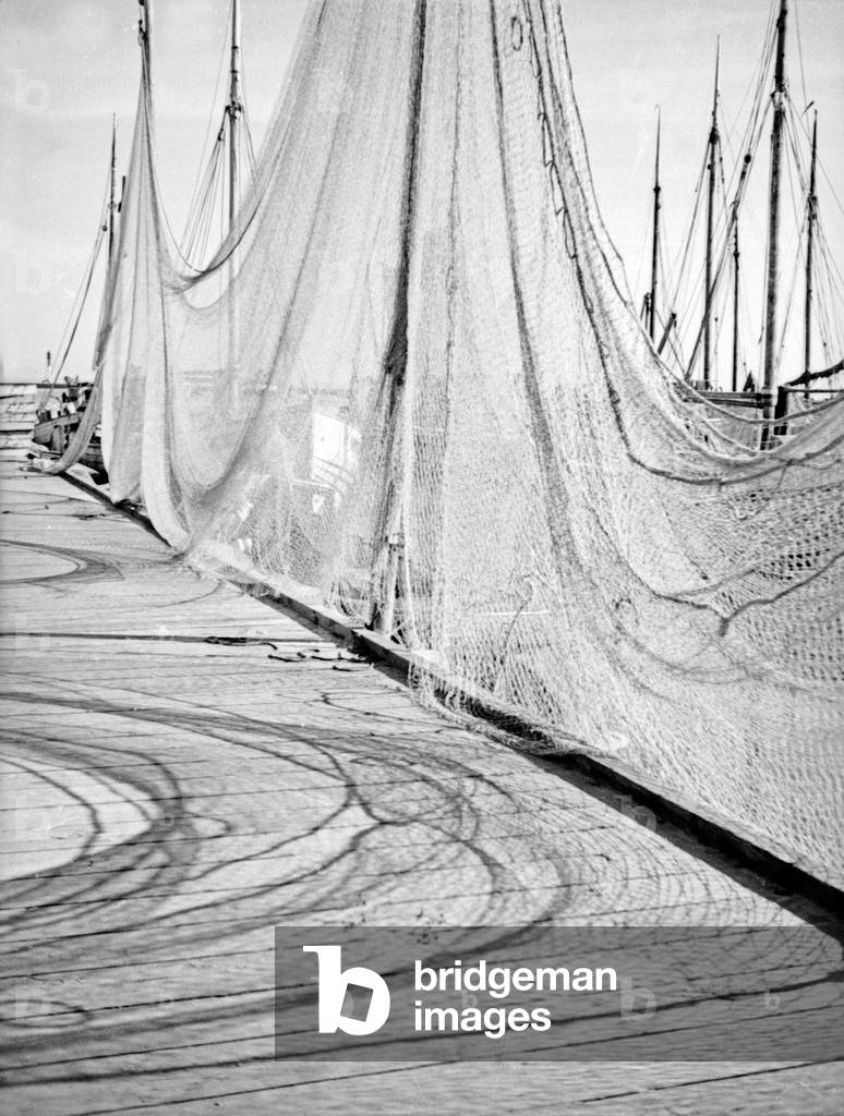 Fisherman nets at a jetty in a harbor of East Prussia, 1930s (b/w photo)