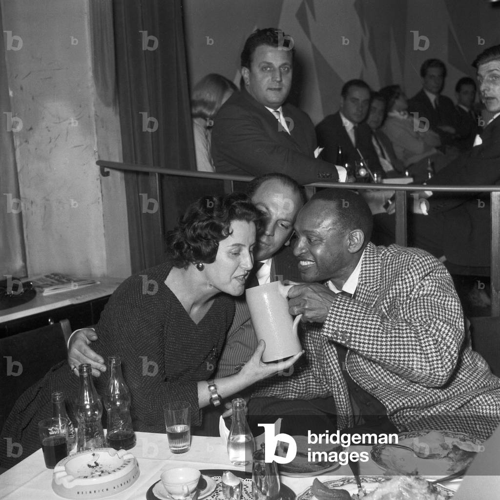 Typical German dish of the day, a beer and a knuckle of pork and sauerkraut for American jazz musician Lionel Hampton, November 30th, 1956