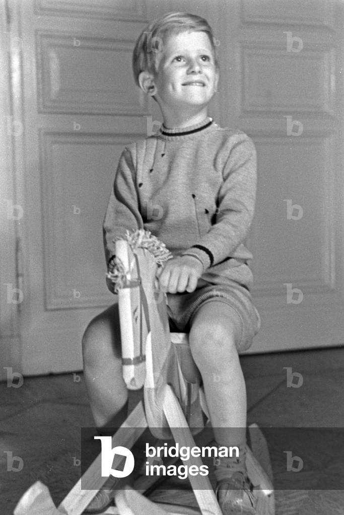 A little boy on his rocking horse, Germany 1930s (b/w photo)
