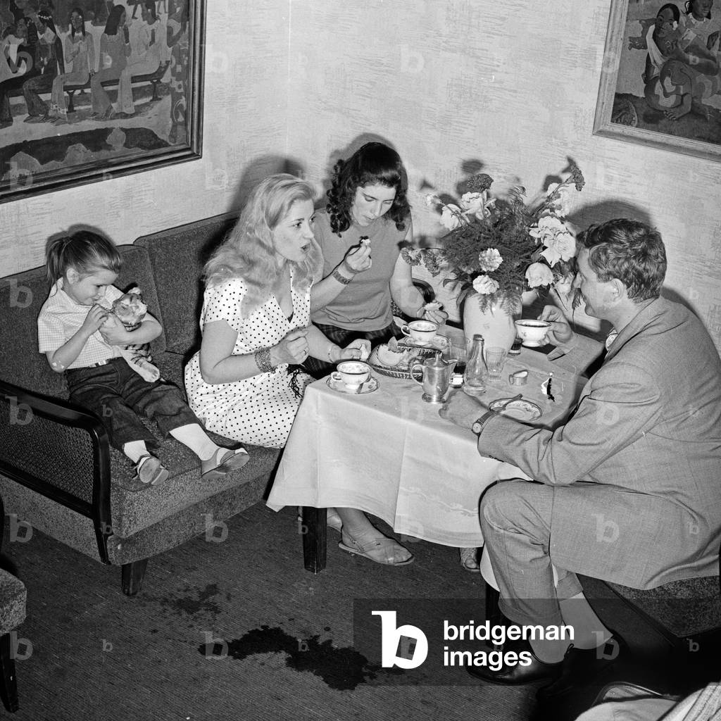 German actress Gisela Uhlen (couch, middle) with her daughters Susanne (left) and Barbara Bertram after returning from East Berlin to Western Germany at Hamburg, 1960s