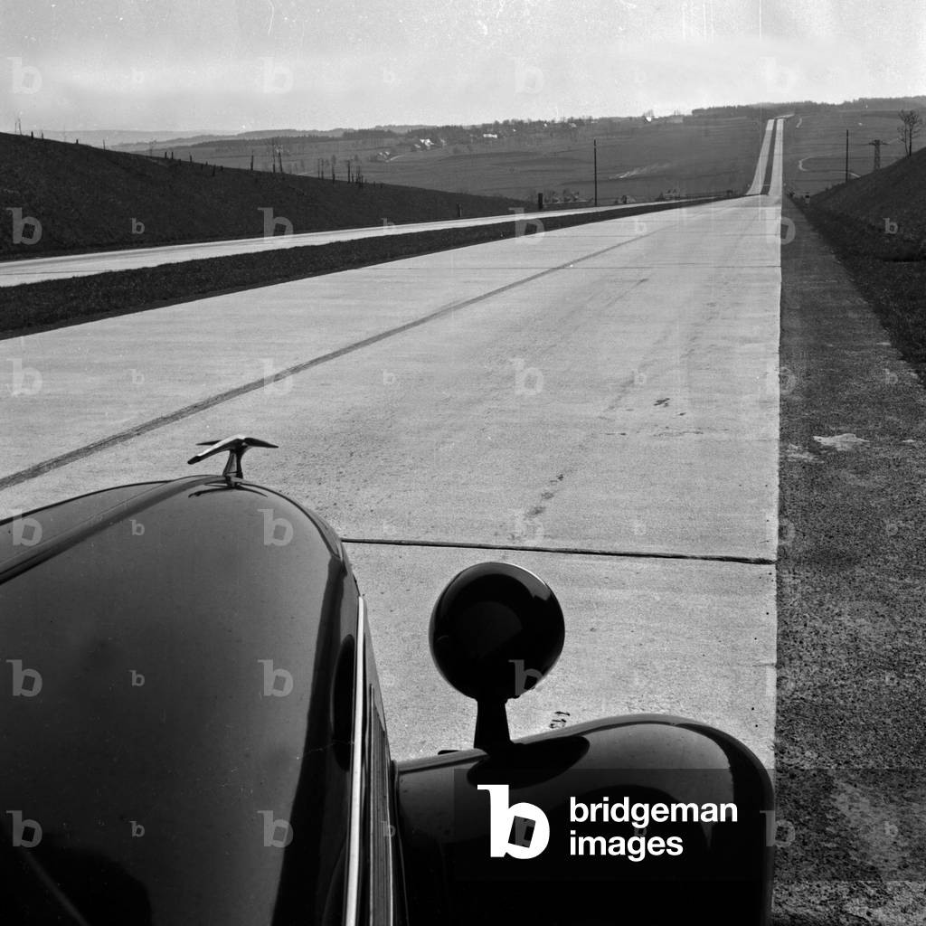 As a co driver on the Reichsabutobahn highway, Germany 1930s (b/w photo)
