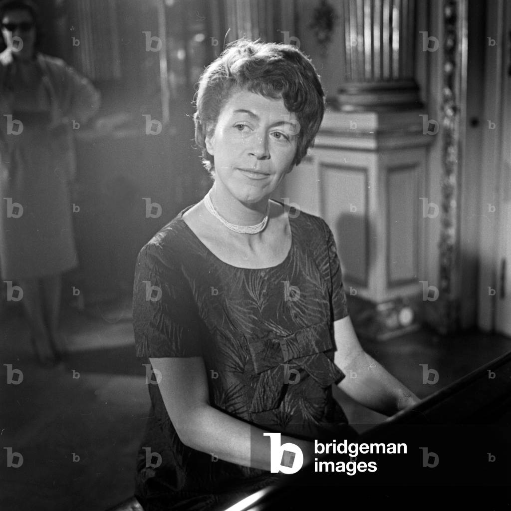A pianist performing with her grand piano at Hamburg, Germany 1960s