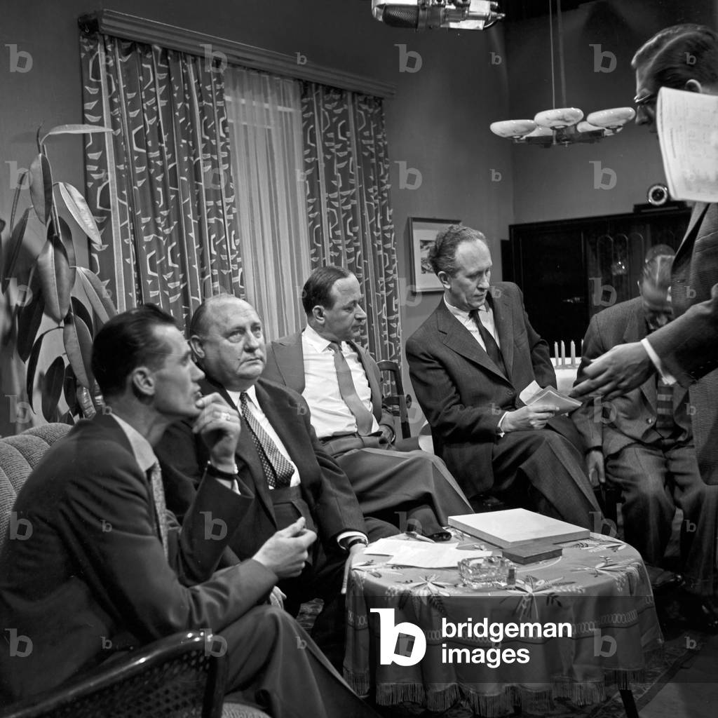 Men sitting and discussing at Hamburg, Germany 1950s