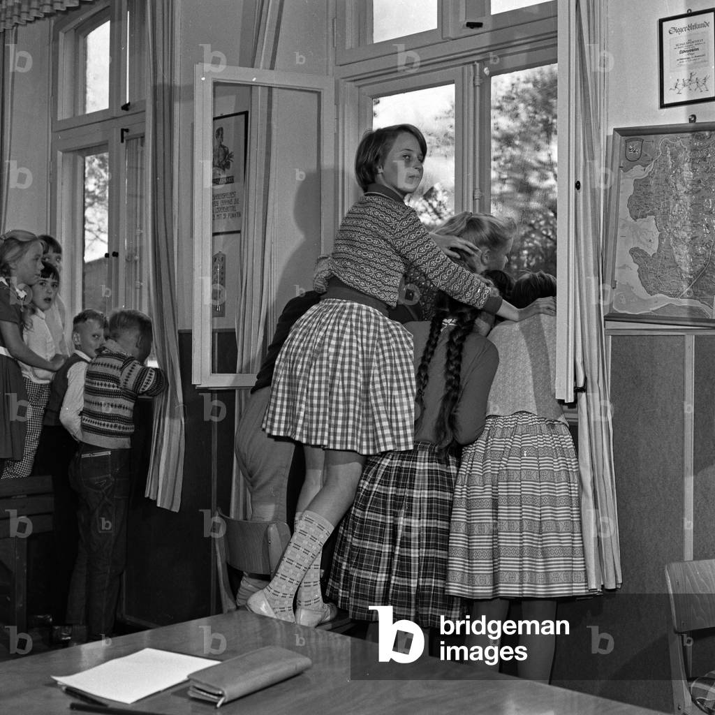 School kids can not wait to get their own TV in the building at Luedersbuettel, Germany 1960s