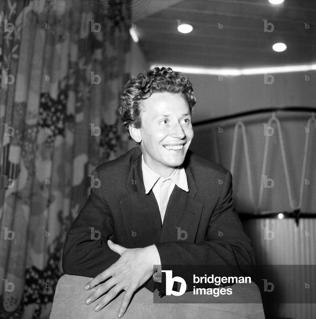 A young man with a cigarette in the staircase of German TV and radio station NDR at Hamburg, Germany 1950s