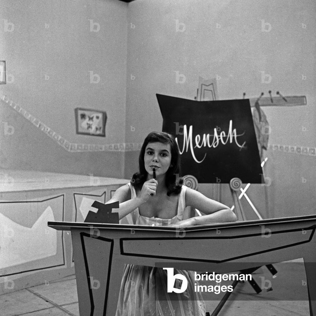 A young actress acting in a school scene, Germany 1950s