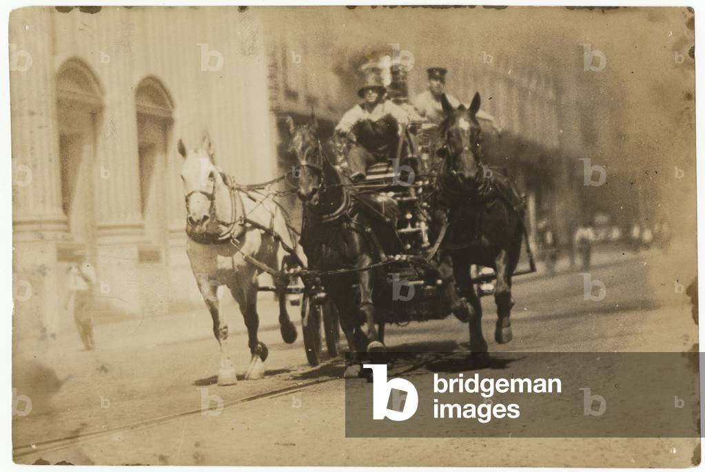 A Horse-drawn Fire Engine Races to a Fire, 1915 (b/w photo)