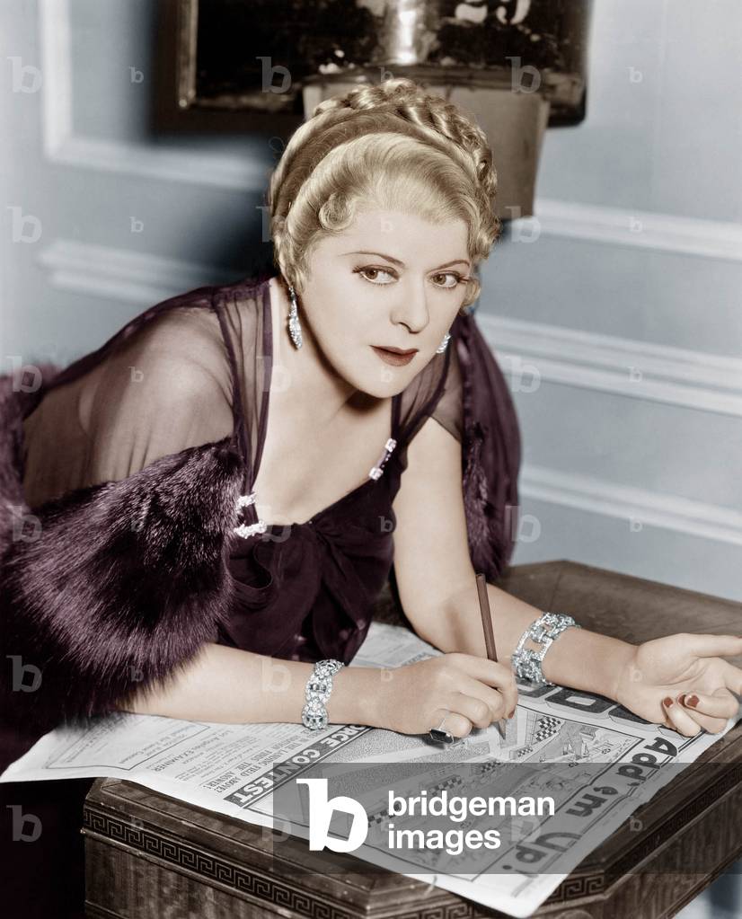 Woman Doing Puzzle in Newspaper