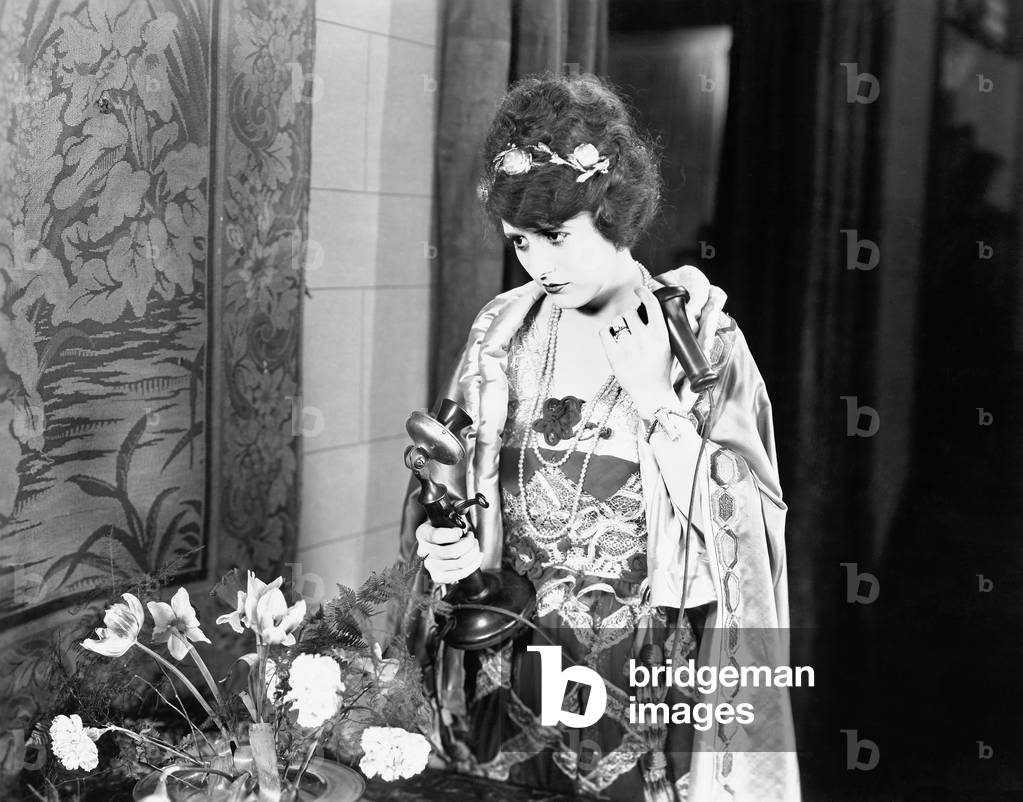 Portrait of Woman Using Telephone