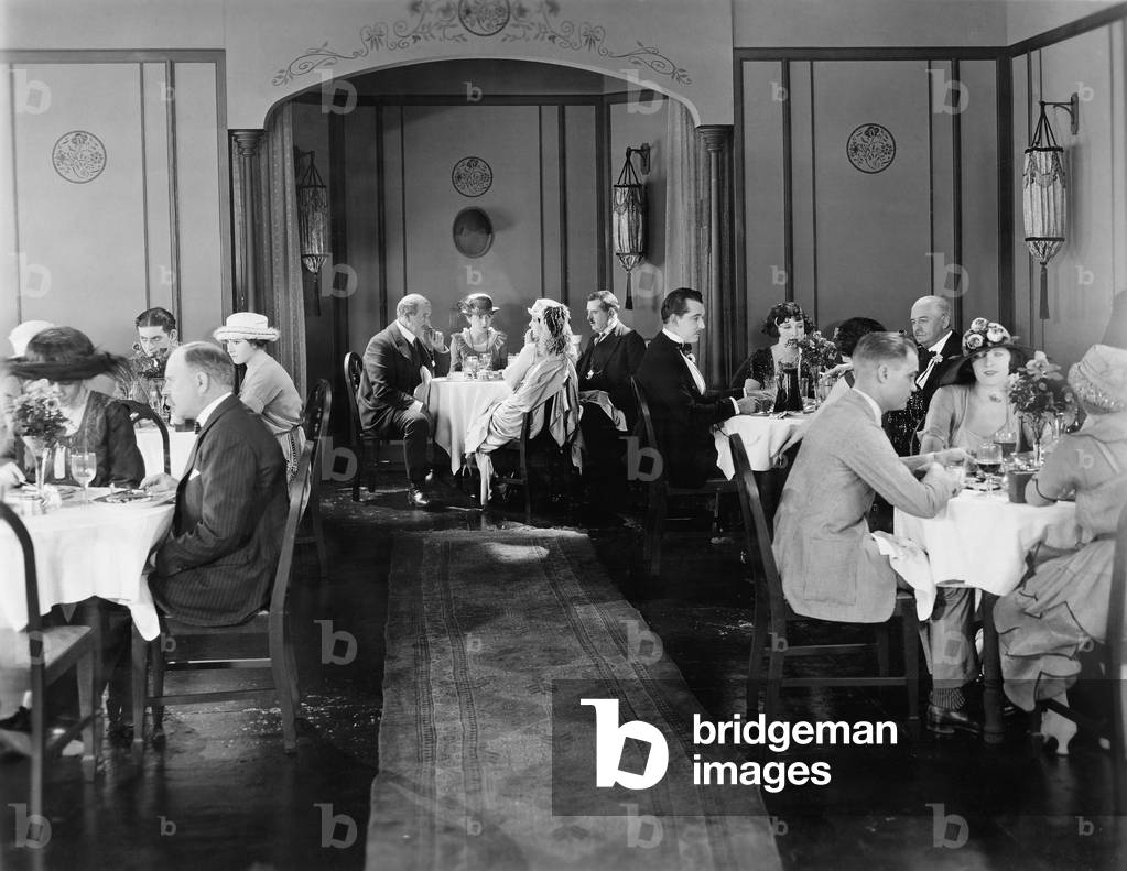 Group of People Sitting in a Restaurant Having Dinner