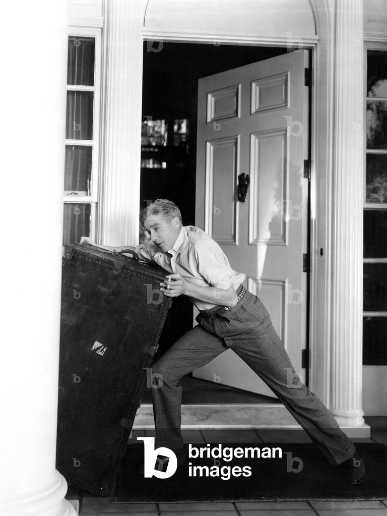 Man Moving Heavy Trunk