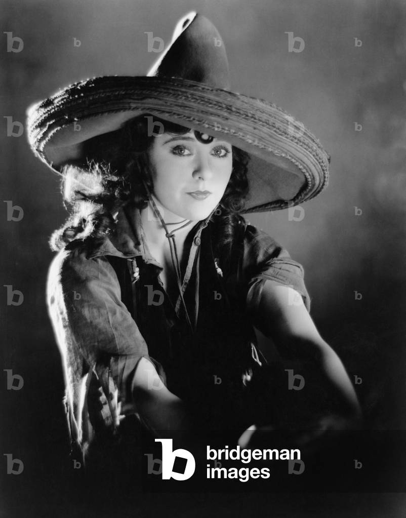 Portrait of a Young Woman Wearing a Mexican Hat