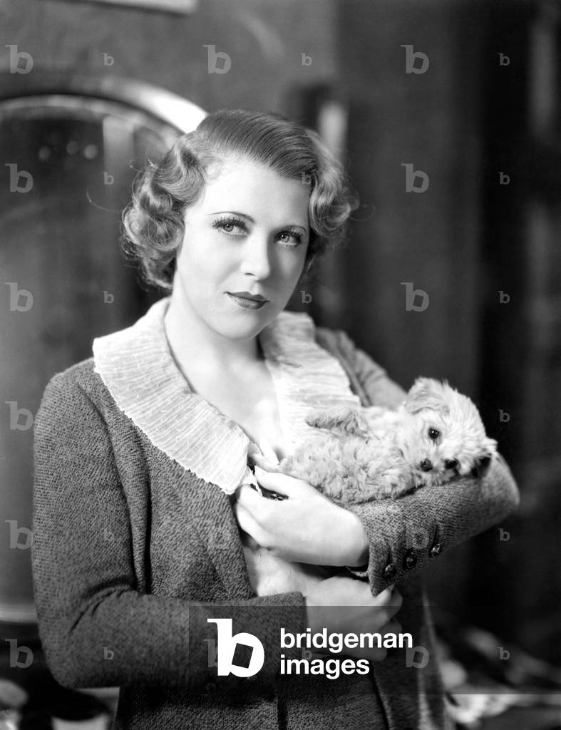 Woman Holding TiNY Puppy