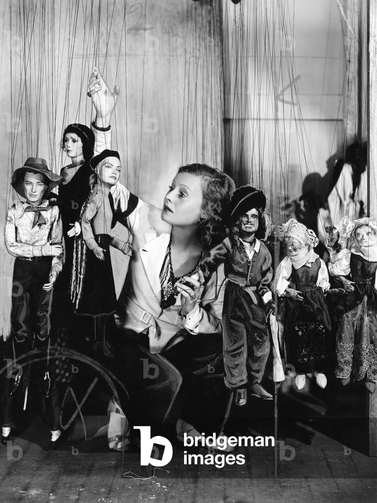 Young Woman Playing with Puppets on the String