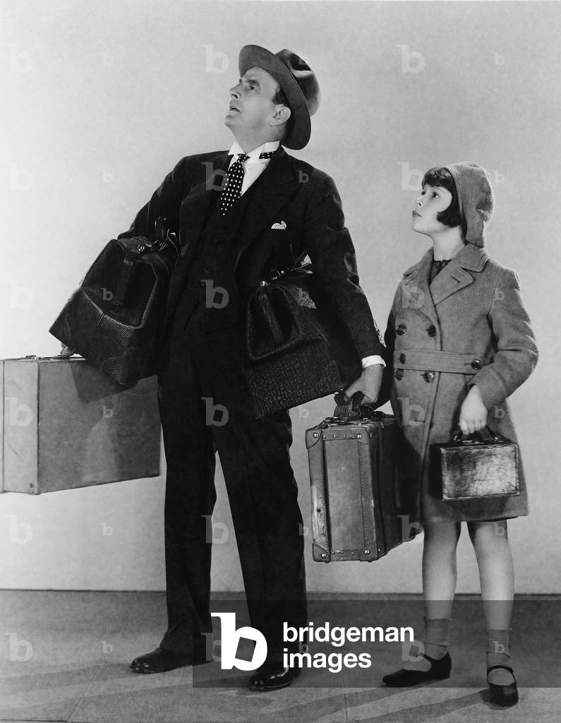 Father and Daughter with Luggage
