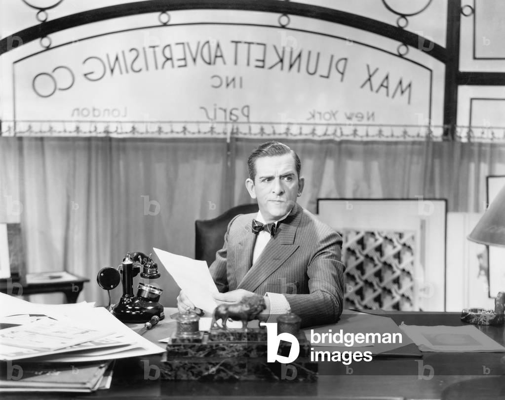 Man Sitting at his Desk in the Office