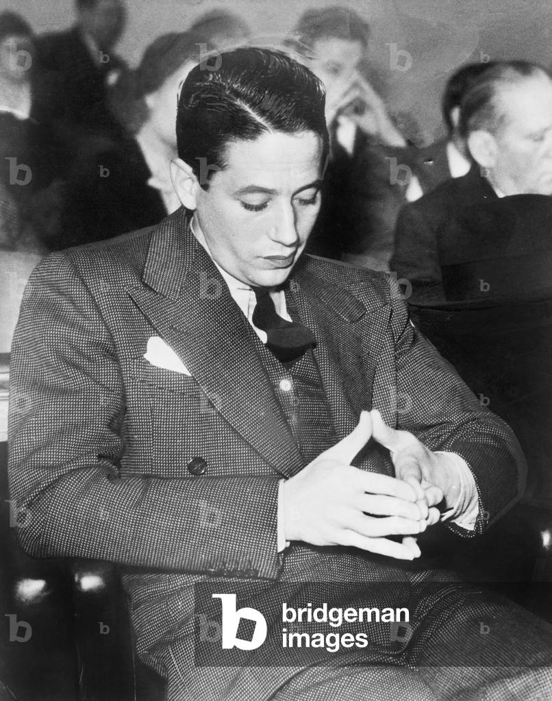 Man Playing with his Fingers Sitting and Waiting