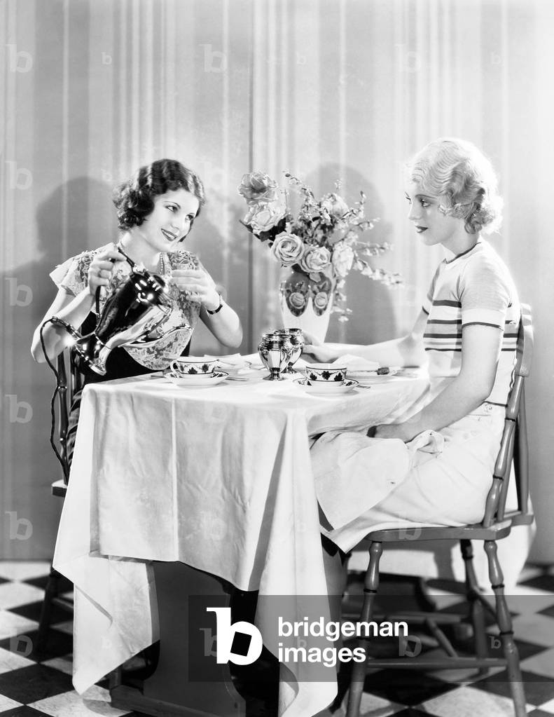 Two Women Having Tea Together
