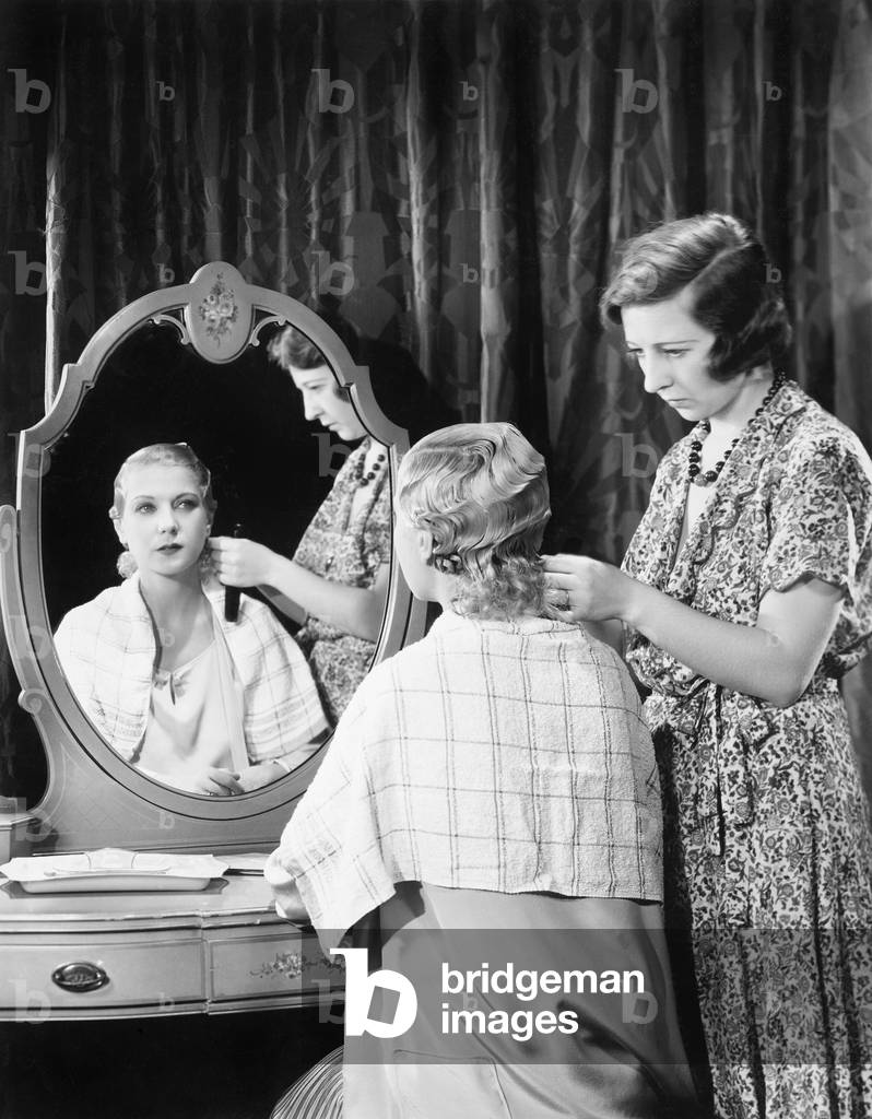 One Woman Doing an Other Woman's Hair