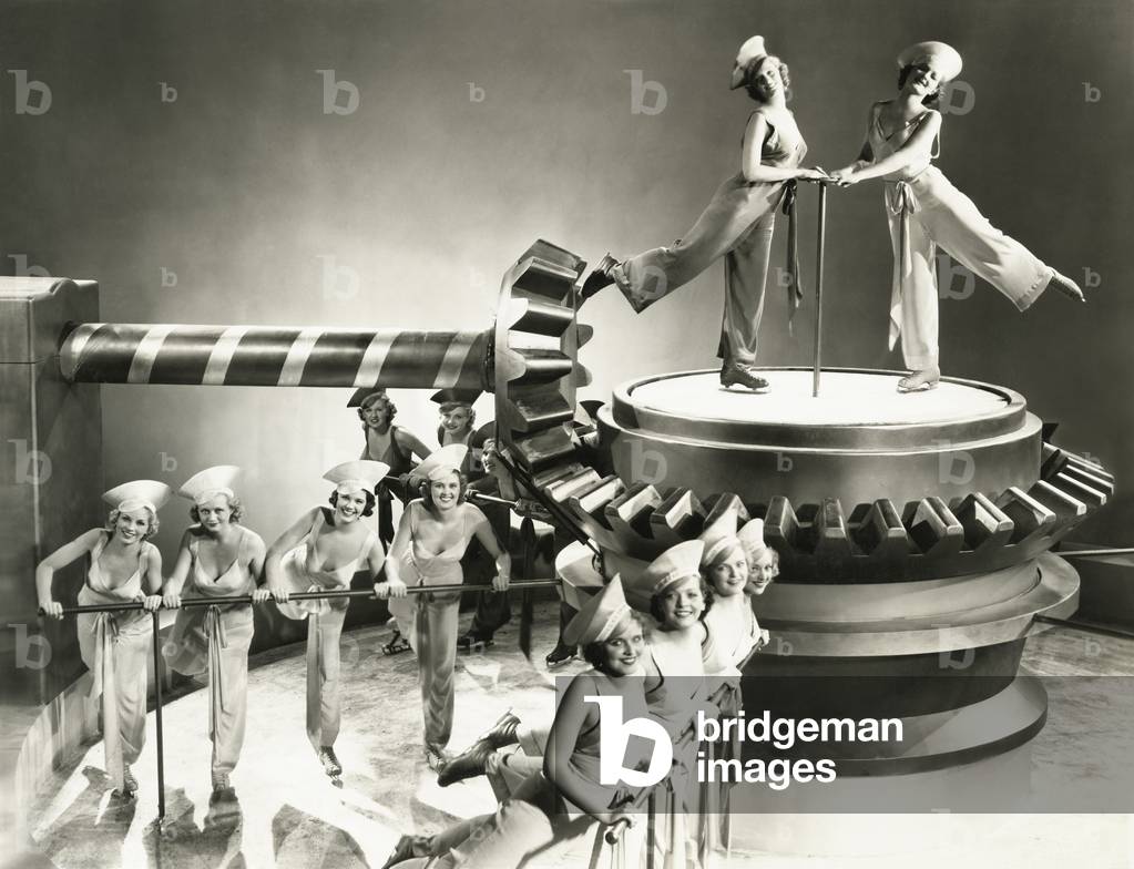 Chorus girls dancing on machine part - (ov164)