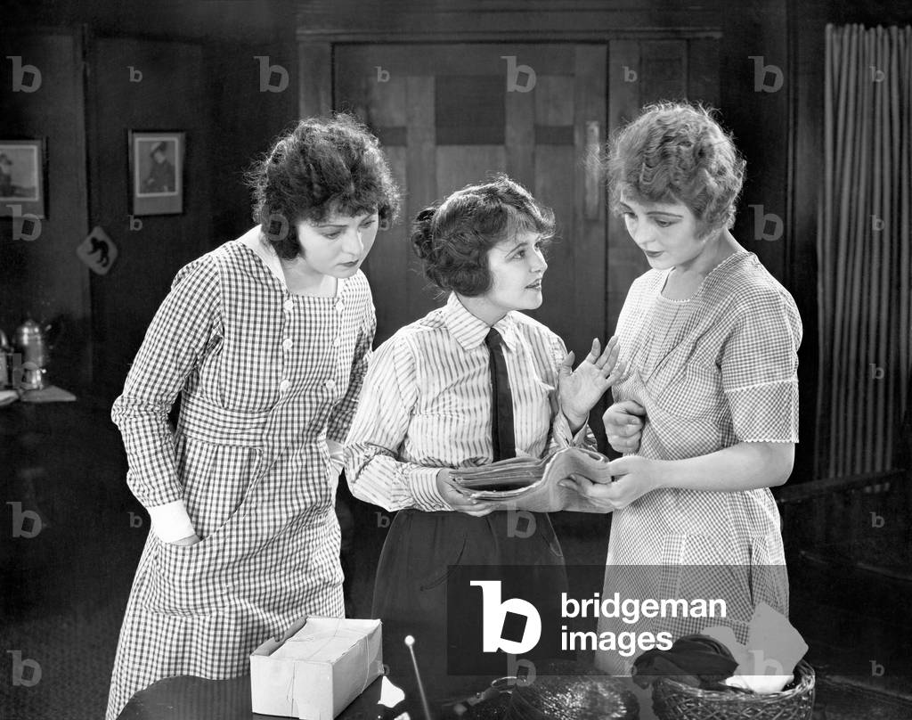 Young Women Reading Exciting News