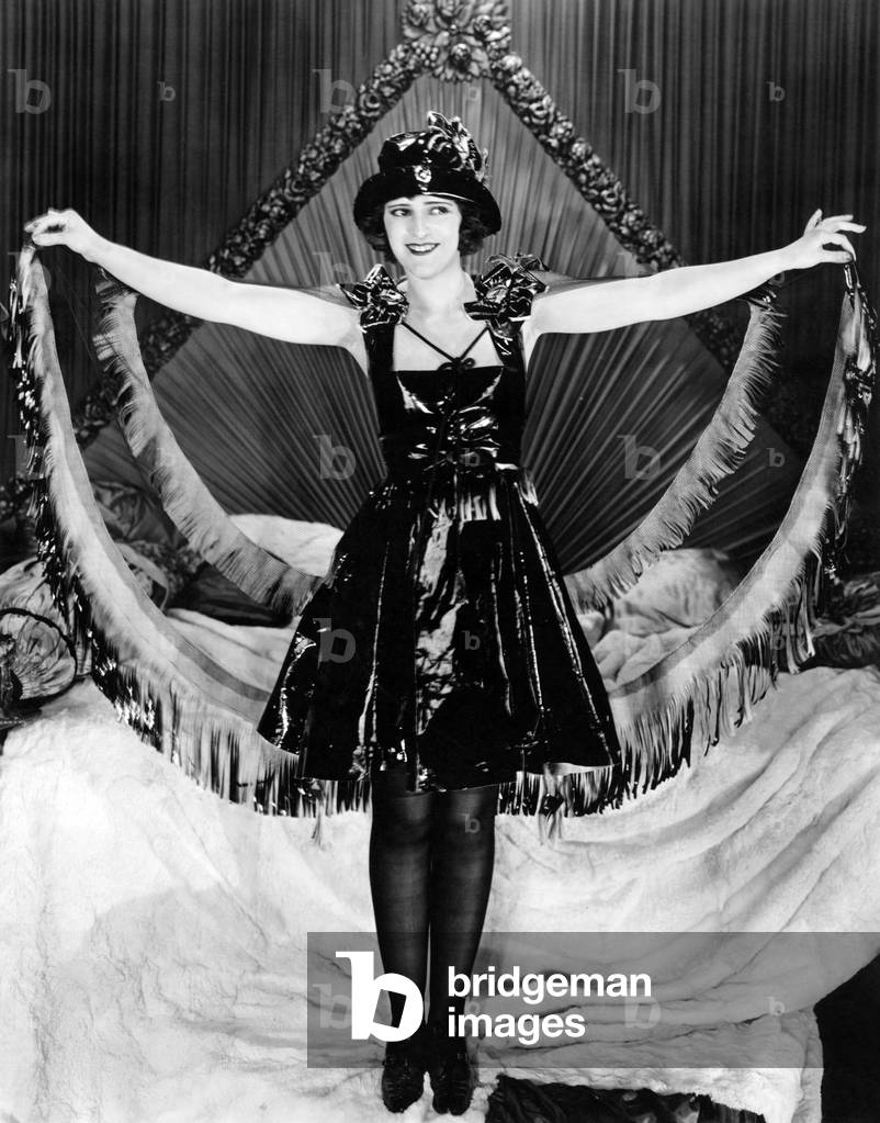 Woman posing in party clothes