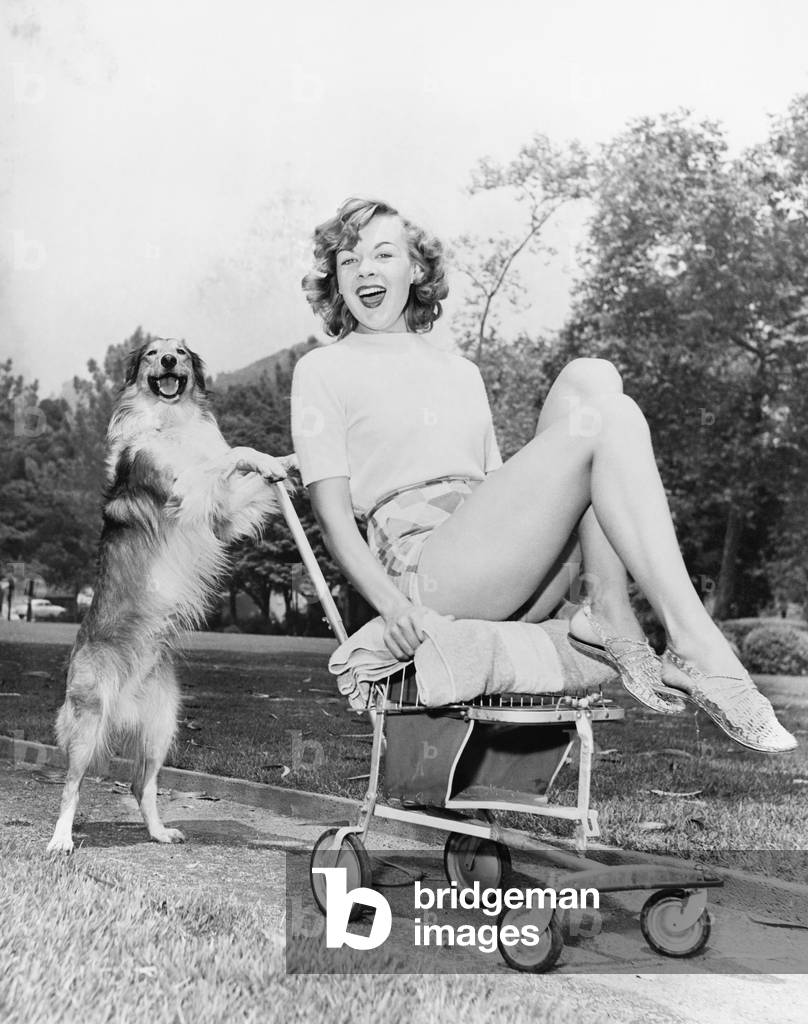 Young Woman and her Pushy Pet Dog
