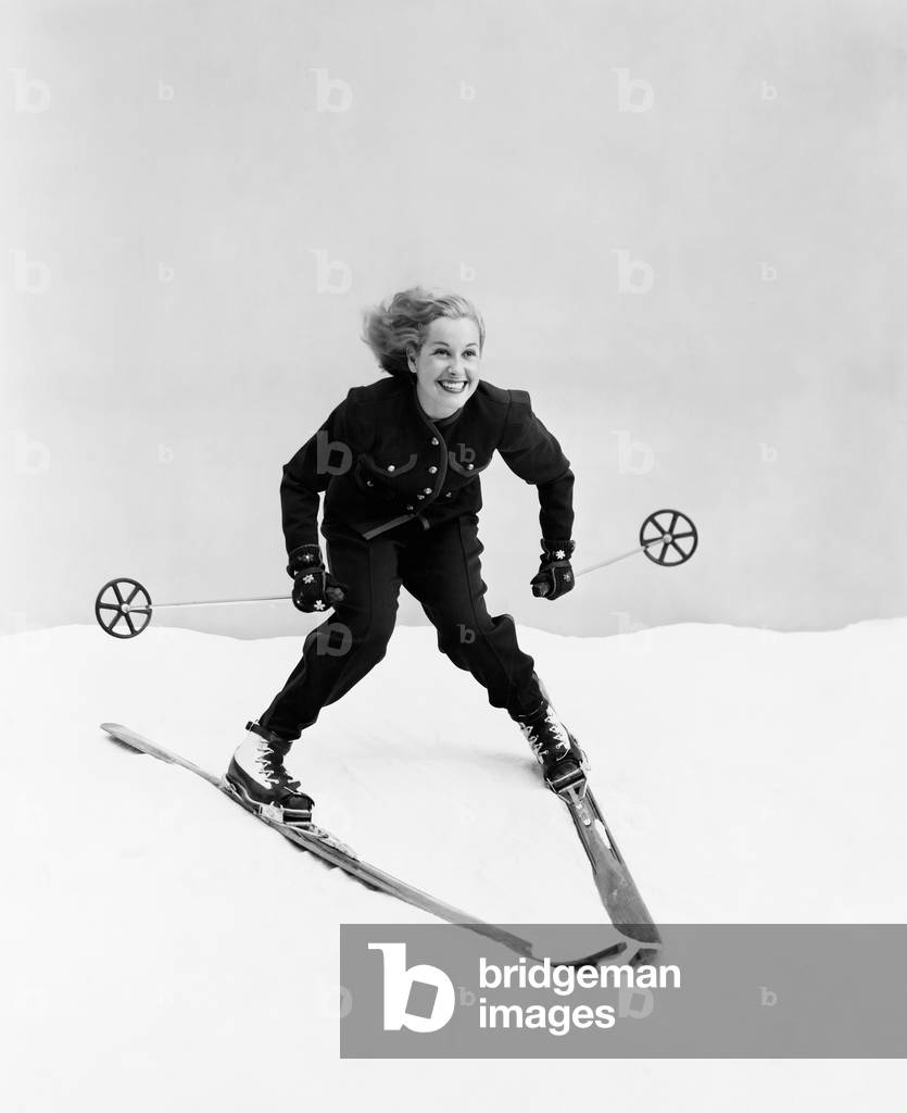 Female Skier Skiing Downhill