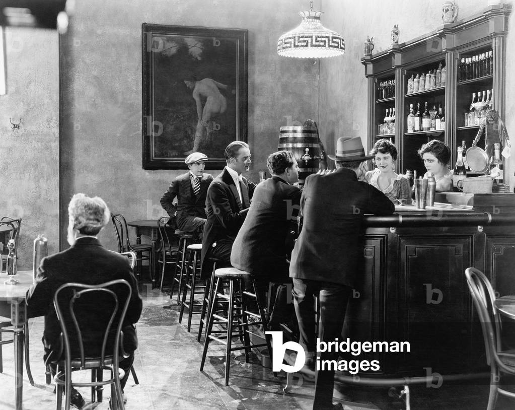 Men Sitting Around a Counter in a Bar