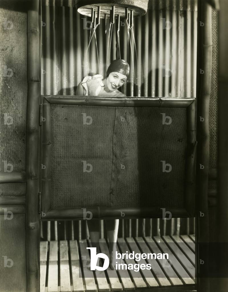 Woman takes a shower in a bathing cap - (ov331)