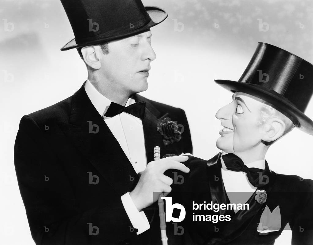 Man and his Puppet Looking at Each Other