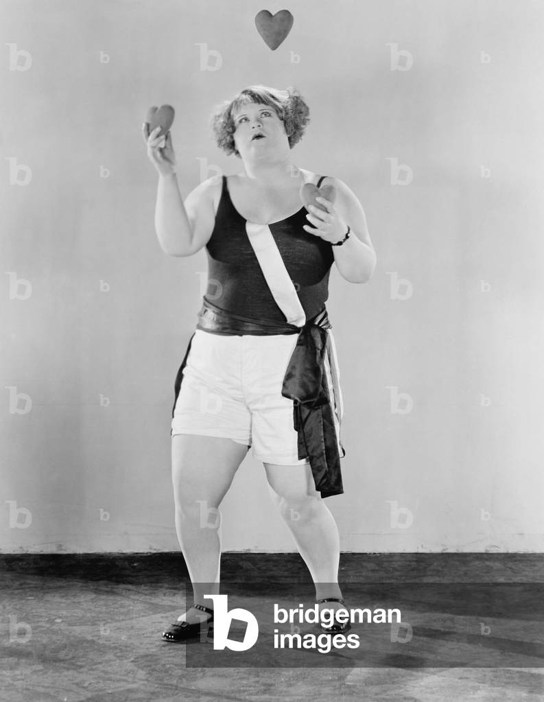 Woman Juggling with Heart Shaped Objects
