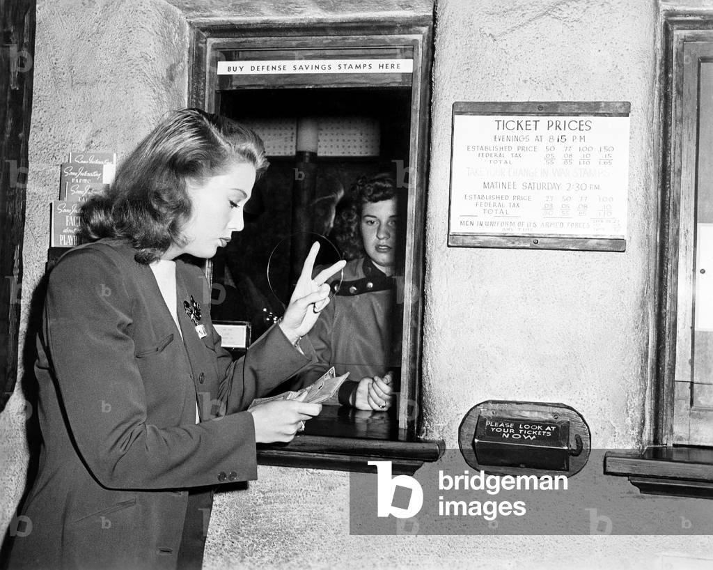 One Woman Buying Two Tickets