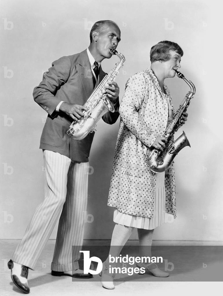 Couple Playing Saxophones Together