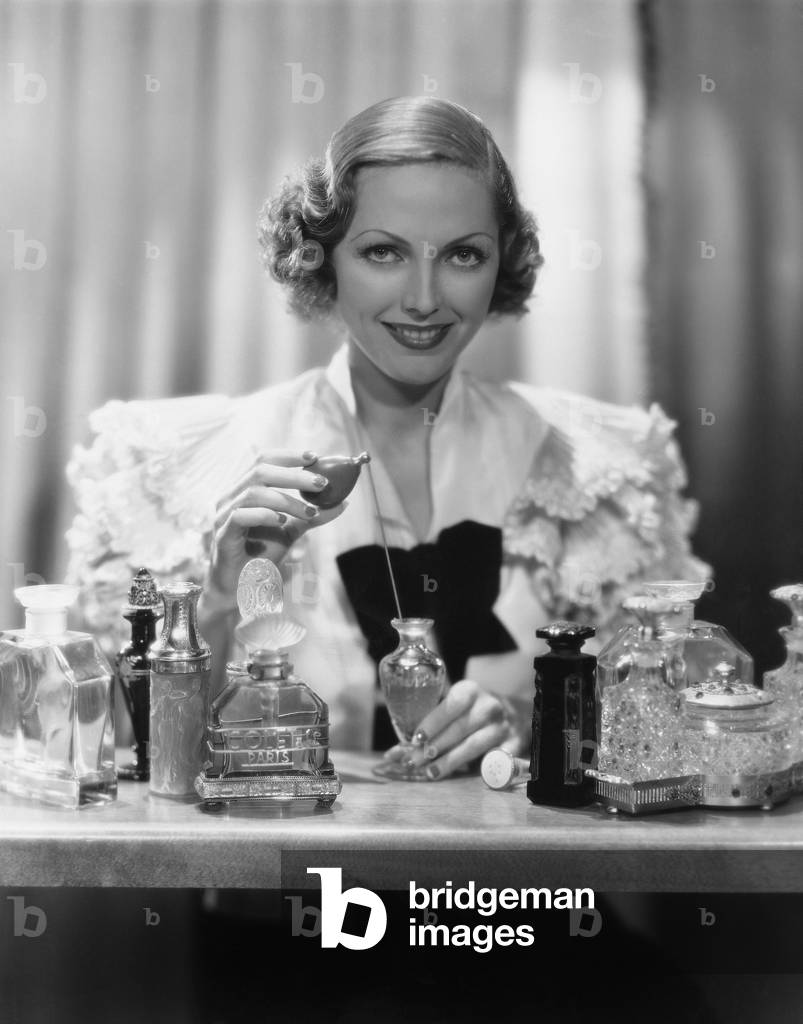 Portrait of Woman with Perfume Bottles