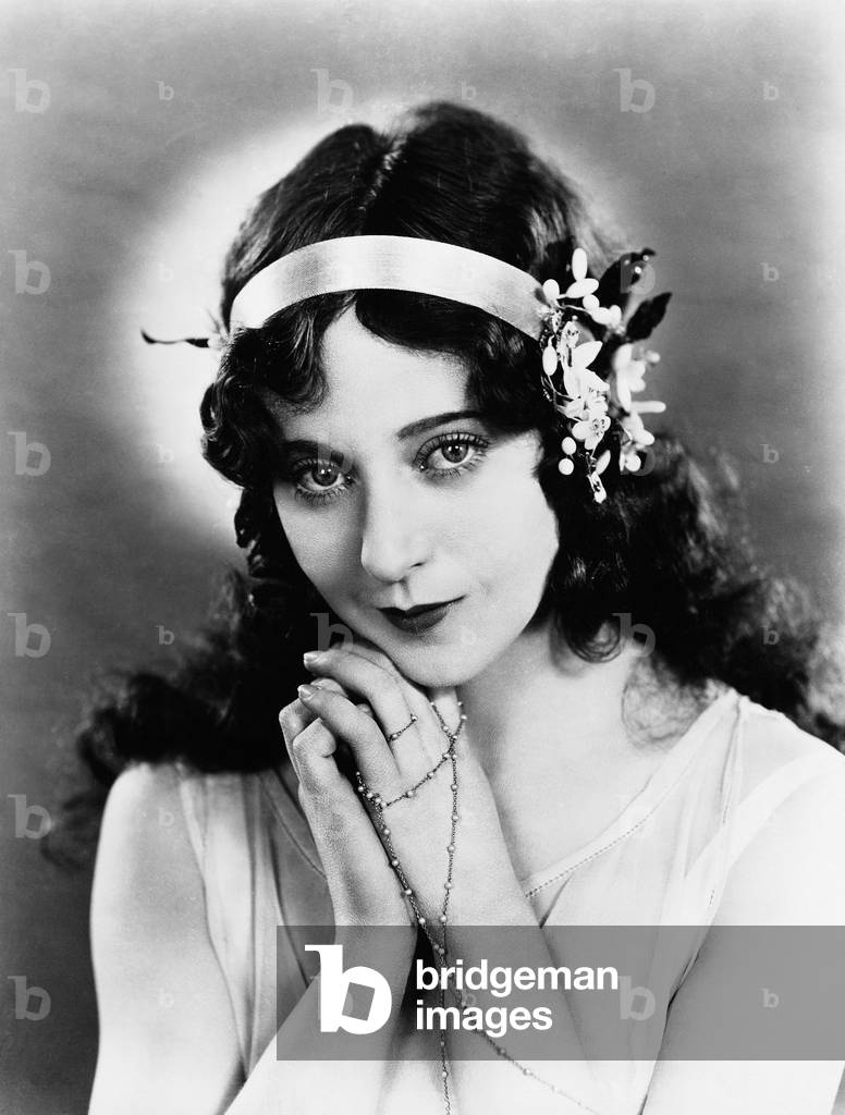 Portrait of Woman with Ribbon and Flowers in Hair